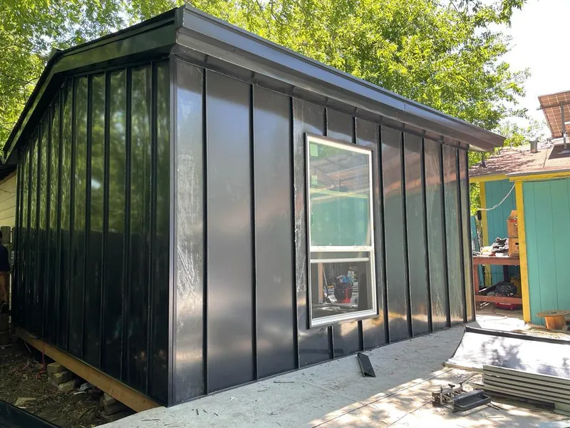 Black standing seam metal wall panels for Metal Roof Installation in Fenton