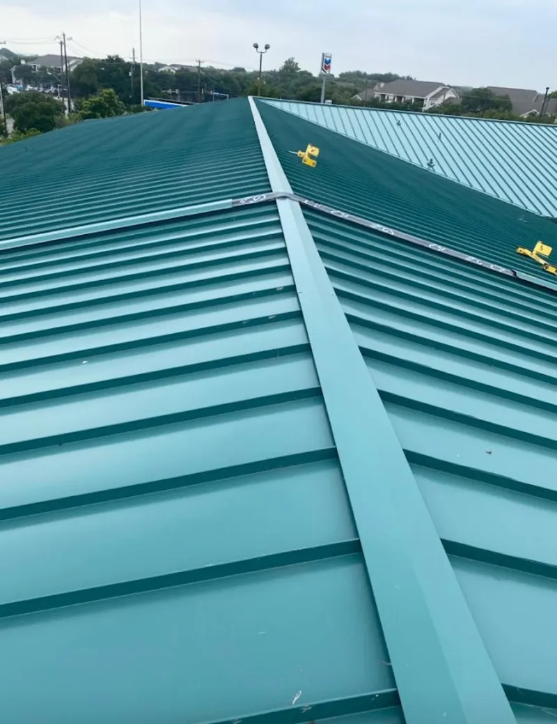 Green commercial metal roof ridge and valley for Metal Roof Repair in Fenton